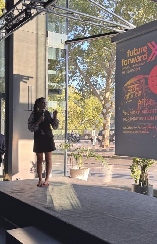 Iva speaking on stage at Future Forward